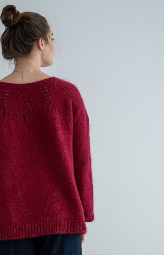 Sweater with a round yoke pattern