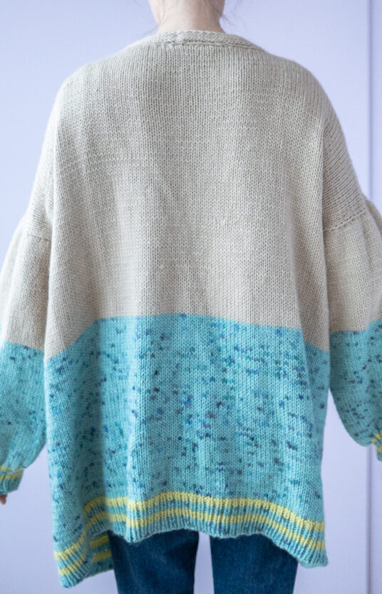 Knitting pattern for a long cardigan with pockets
