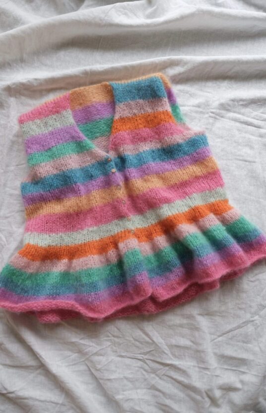 Knitted vest with stripes and ruffles. Cool knitting patterns online store knit and yarn