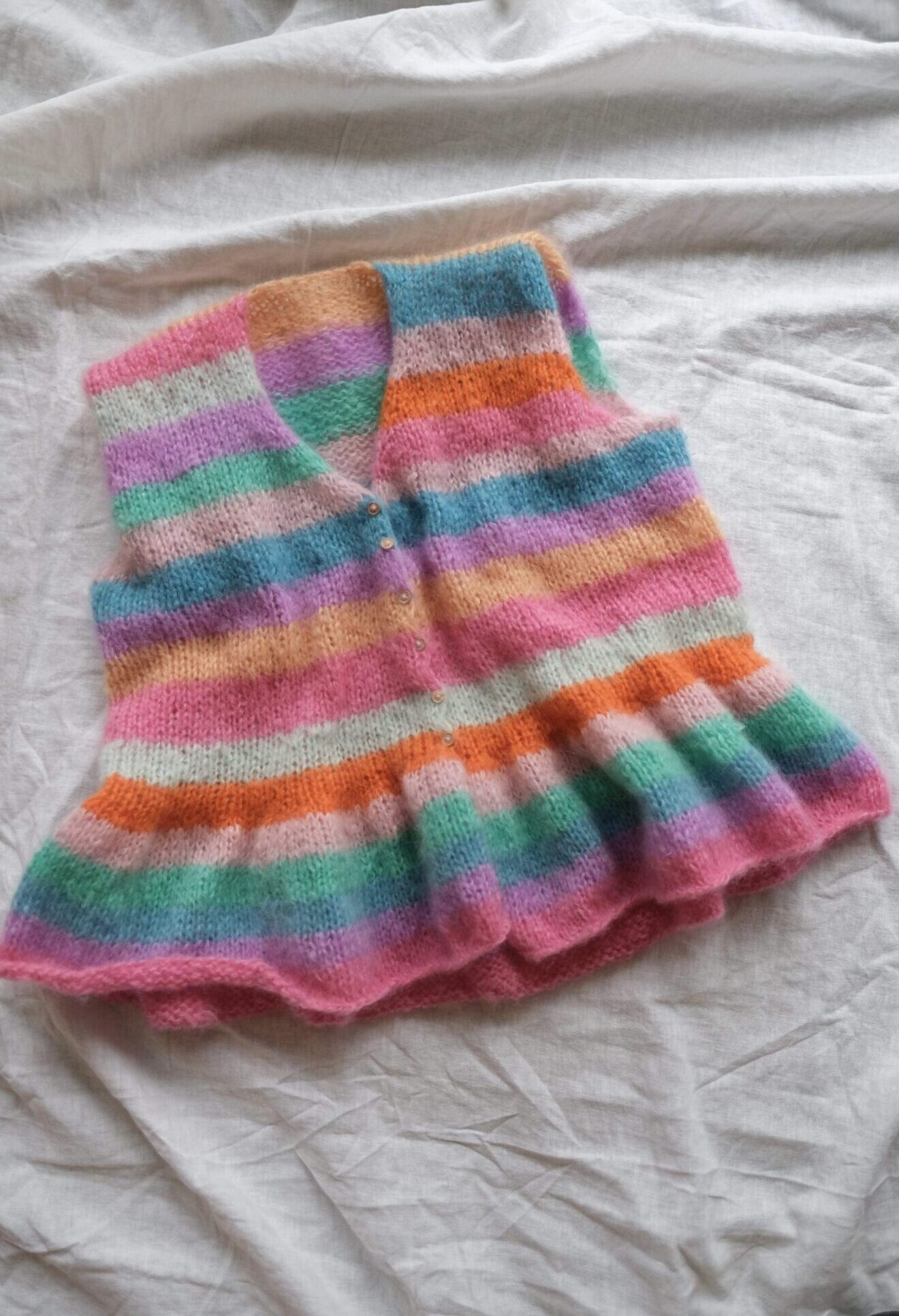 Swirl Vest Knitting Pattern - HipKnitShop Knitted vest with stripes and ruffles. Cool knitting patterns online store knit and yarn