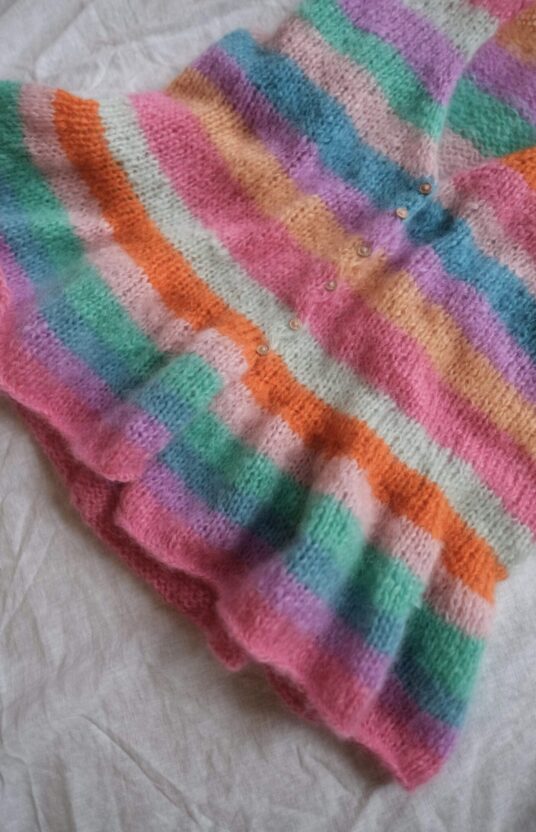 Knitted vest with stripes and ruffles. Cool knitting patterns online store knit and yarn