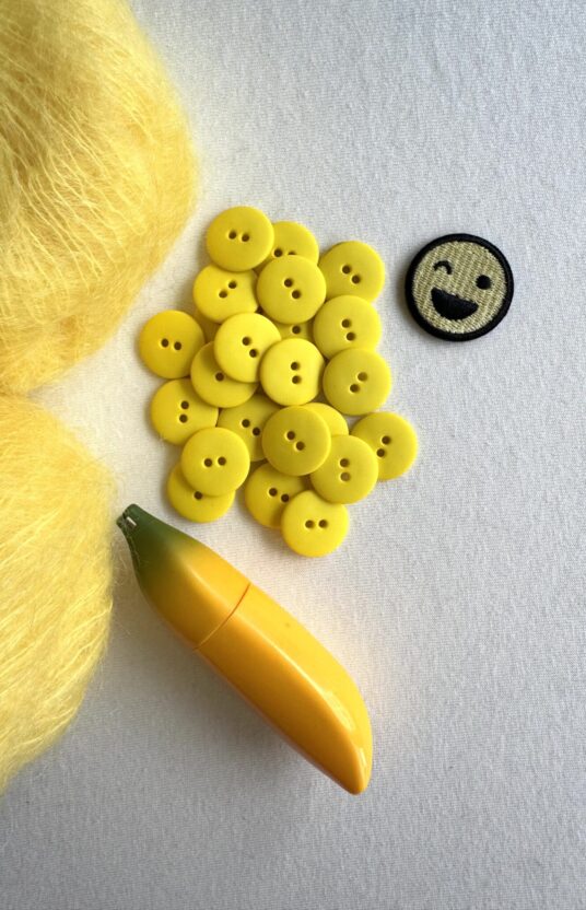 Matte yellow plastic button