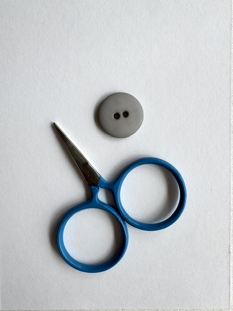 Gray matte plastic button