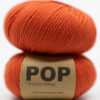 Merino yarn red orange color. Soft merino colorful yarn