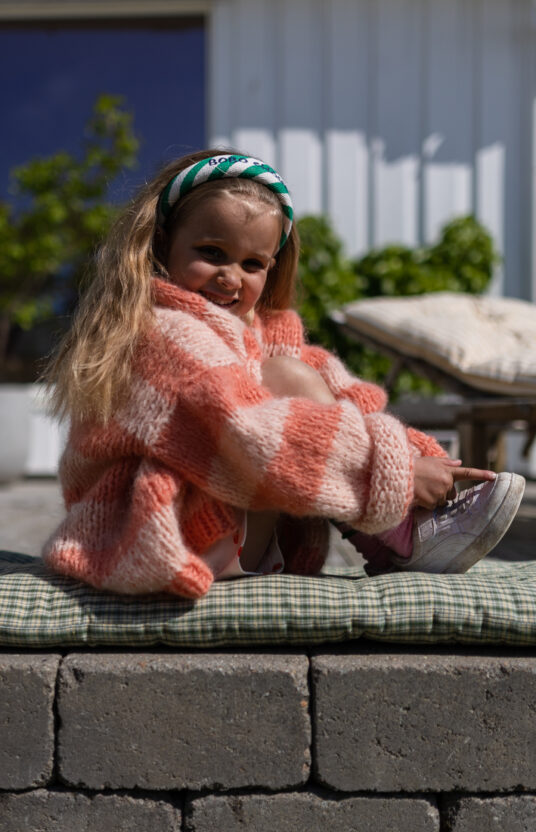 Knitted cardigan for girl pattern. Knitting pattern cozy cardigan knitted for children with stripes. Inspiration knit girl