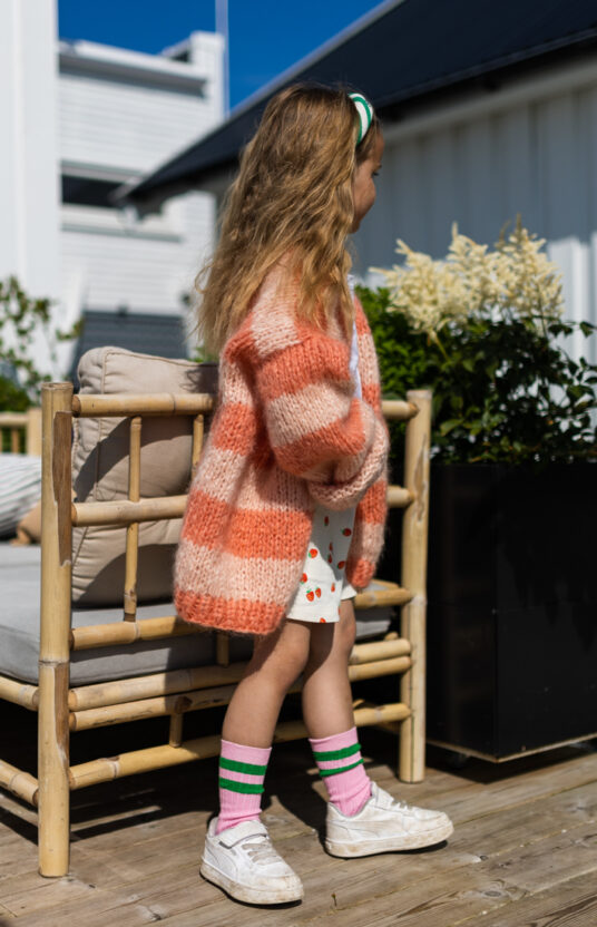 Knitted cardigan for girl pattern. Knitting pattern cozy cardigan knitted for children with stripes. Inspiration knit girl