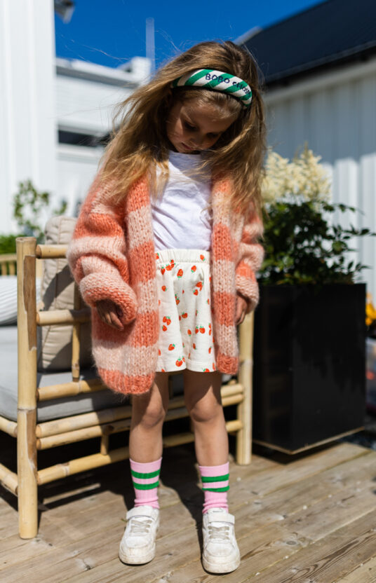 Knitted cardigan for girl pattern. Knitting pattern cozy cardigan knitted for children with stripes. Inspiration knit girl