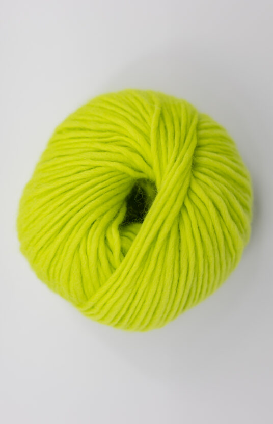 Kiwi-colored yarn. Wool yarn for knitting with thick needles. Pure wool, non-itchy wool, neon light green yarn.