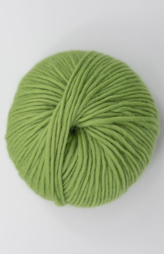 Yarn in green color for knitting. Colorful wool yarn for sweaters and jackets. Itch-free RWS merino wool yarn