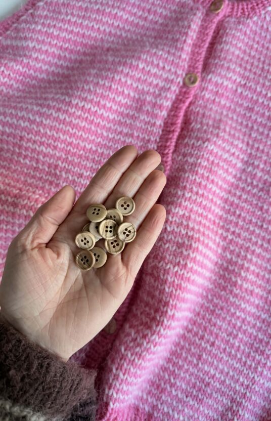 Wooden buttons for a knit cardigan and vest. Nice buttons for a knit online store